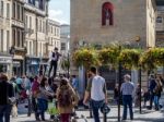 Playing The Violin Whilst Balancing On A Titghtrope Stock Photo