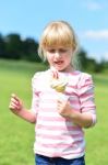 Cute Little Girl Eating Ice Cream Stock Photo