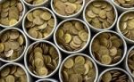 Many Coin Lined In Silver Bowl Stock Photo