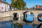 Bridge Over A Canal In Bruges West Flanders In Belgium Stock Photo