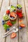 Red And Green Jelly Served With Fruit Stock Photo