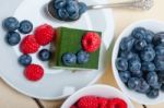 Green Tea Matcha Mousse Cake With Berries Stock Photo