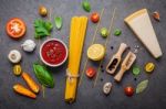 The Thin Spaghetti On Dark Stone Background. Yellow Italian Past Stock Photo