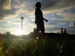 Silhouette  Running On Road At Sunrise Stock Photo