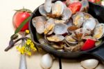 Fresh Clams On An Iron Skillet Stock Photo