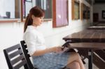 Portrait Of Thai Adult Businesswoman Beautiful Girl Using Her Tablet Stock Photo