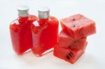 Bottle Of Fresh Watermelon Juice With  Watermelon Pieces  On Whi Stock Photo