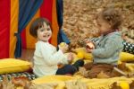 Children Play In The Park And Eating Apple Stock Photo