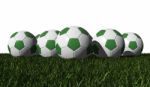 Green Soccer Balls On A Green Grass Stock Photo