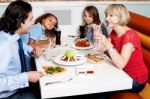 Family Eating Together In Hotel Stock Photo