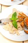 Italian Gnocchi With Seafood Sauce With Crab And Basil Stock Photo