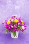 Bouquet Of Chrysanthemum And Orchid Flowers Isolated On Purple V Stock Photo