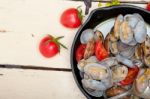 Fresh Clams On An Iron Skillet Stock Photo