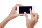 Fingers Zooming In On Cell Phone Stock Photo