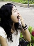 Young Beautiful Brunette Woman Yawning Stock Photo