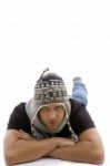 Male Lying And Wearing Woolen Cap Stock Photo