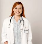 Young Pretty Smiling Female Doctor Stock Photo