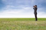 Businessman Using Binoculars Stock Photo