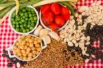 Variety Of Kitchen Ingredients With Fresh And Dried Legumes Stock Photo