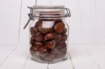 Glass Jar Full Of Chestnuts Stock Photo