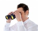 Male Looking Through Binocular Stock Photo