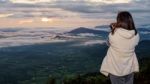 Women Are Shooting Sunrise Stock Photo