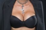 Woman With Big Breasts And Jewelry On Neck Stock Photo