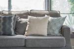 Pillows On Modern Grey Sofa In Living Room Stock Photo