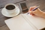 Hot Cup Of Coffee On Working Table Stock Photo