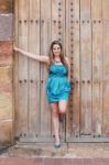 Beautiful Woman In The Dress In Old Wooden Door Stock Photo