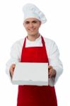 Young Male Chef Delivering Pizza Stock Photo