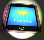 Turkey On Phone Displays Holidays And Sunny Weather Stock Photo