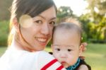 Portrait Of Mother And Babies Stock Photo