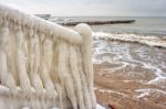 Ice Covered Staircase On The Beach Stock Photo