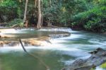 The Water Flowing Over Rocks And Trees Down A Waterfall At Huay Mae Khamin Waterfall National Park ,kanchana Buri In Thailand Stock Photo