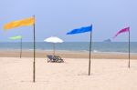 Beach Chairs And White Umbrella Stock Photo