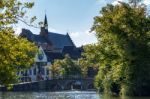 View Along A Canal In Bruges West Flanders In Belgium Stock Photo