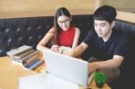 At Home, Two Students Working On A Project On A Laptop, The Atmo Stock Photo