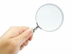 Hand Holding Magnifying Glass Stock Photo