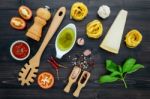 The  Pasta On Black Wooden Background. Yellow Italian Pasta With Stock Photo