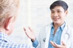 Doctor With Patient Stock Photo