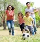 Family Playing Football Stock Photo