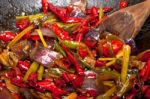 Fried Chili Pepper And Vegetable On A Wok Pan Stock Photo