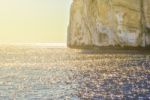 Clear Water Sea With Rocky Coastline Stock Photo