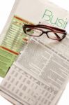 Business News Paper With Glasses Stock Photo