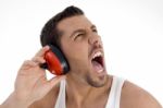 Young Guy Enjoying Rock Music With Full Volume Stock Photo