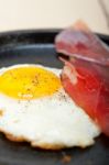 Egg Sunny Side Up With Italian Speck Ham Stock Photo