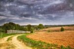 Rain. Spring Storm Clouds Above Country Road Stock Photo