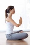 Beautiful Young Woman Doing Yoga Exercises At Home Stock Photo