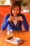 Asian Girl Drinking Tea In Morning Stock Photo